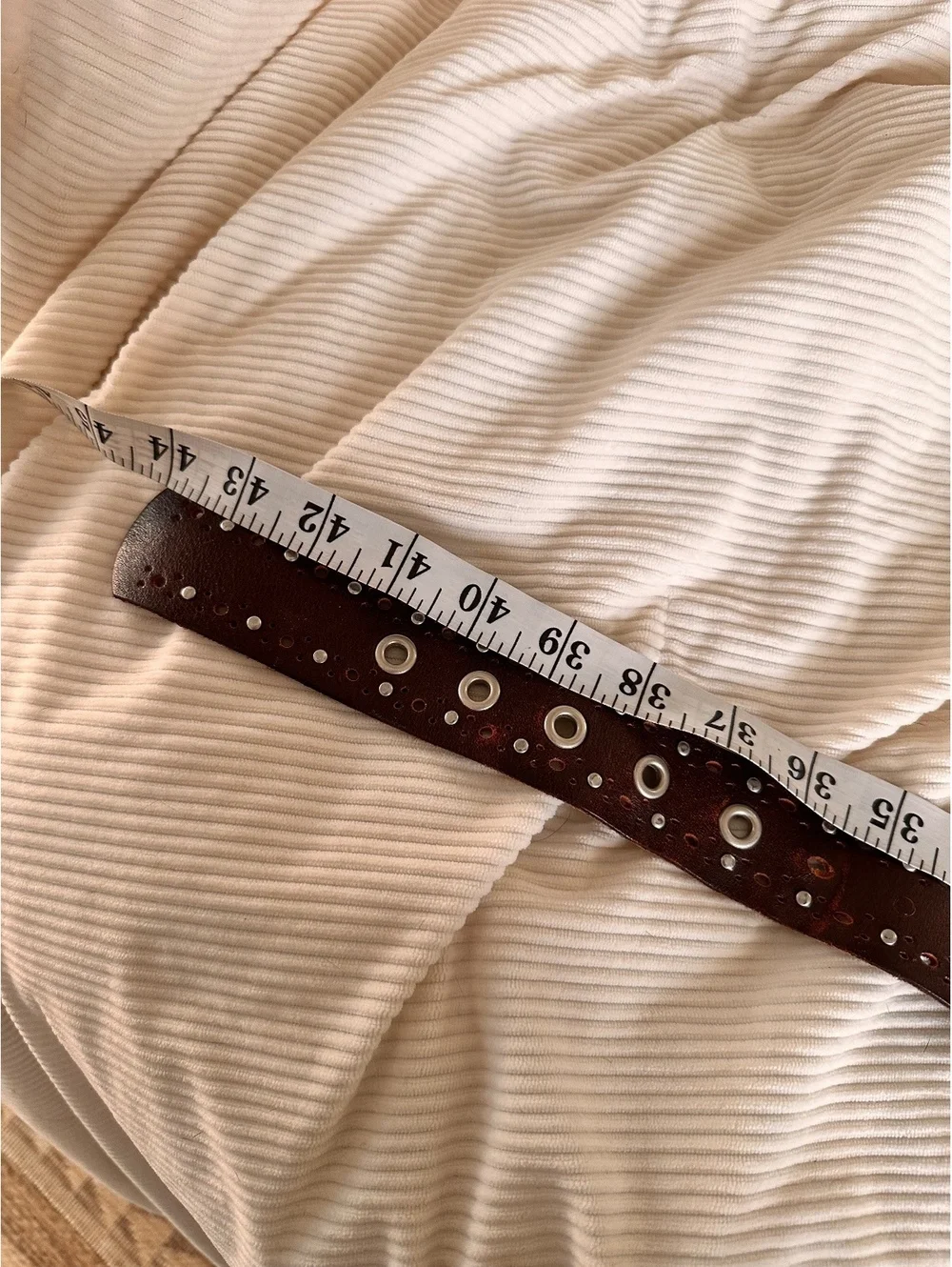 Brown Leather Belt with Silver Eyelets and Round Buckle, Approximately 42 Inches
